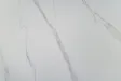 Table ronde Unique 120 cm — céramique effet marbre blanc, pied blanc