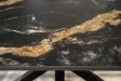 Table Galaxie céramique noire dorée 180 cm piètement étoilé